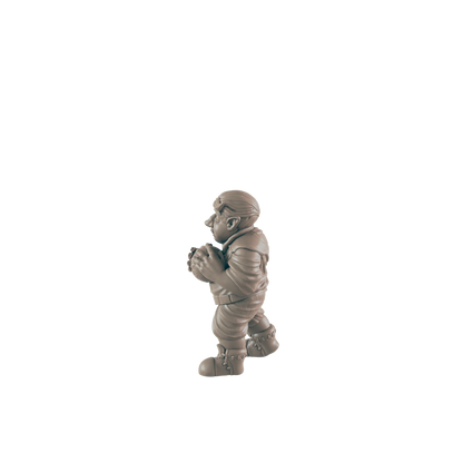 A small, stout figurine holds a sphere, standing against a dark background.