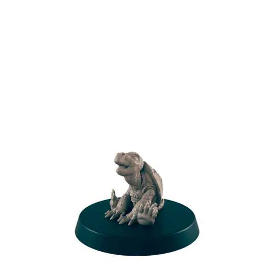 A turtle figurine sits on a dark circular base against a black background.