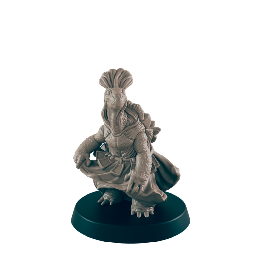 A turtle figurine, wearing a skirt, adjusts its garment.  It stands on a circular base against a dark background.