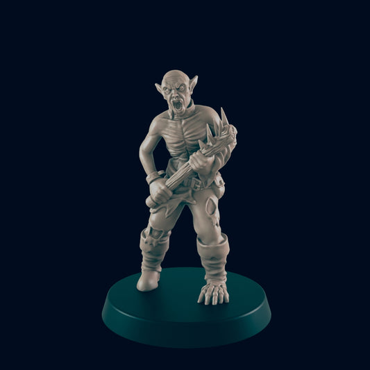 A miniature goblin figure wields a spiked club, aggressively posed on a circular base.