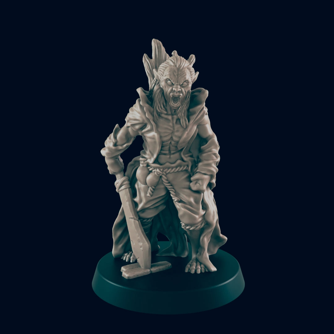 The monster figure stands aggressively, wielding a shovel on a circular base. It has a ragged cloak and tree-like antlers on its head. The background is black.