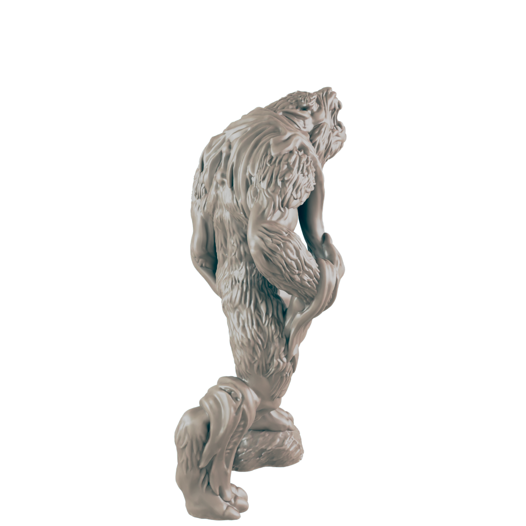 A hairy ape-like creature figurine, crouching, is presented against a dark background.