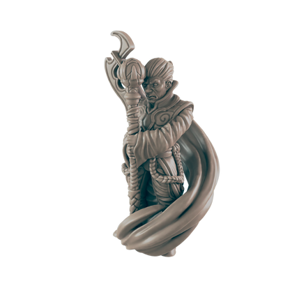 A wizard figurine clutches a staff. He wears robes and has an unpleasant expression. The background is pure black.