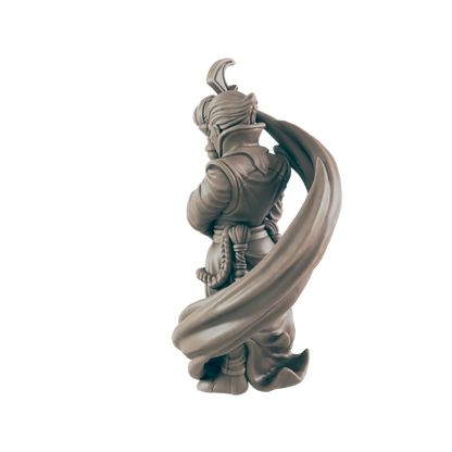 A monochrome figurine with folded arms has its back turned. A billowing cape flows from the character's shoulders against a plain, dark background.