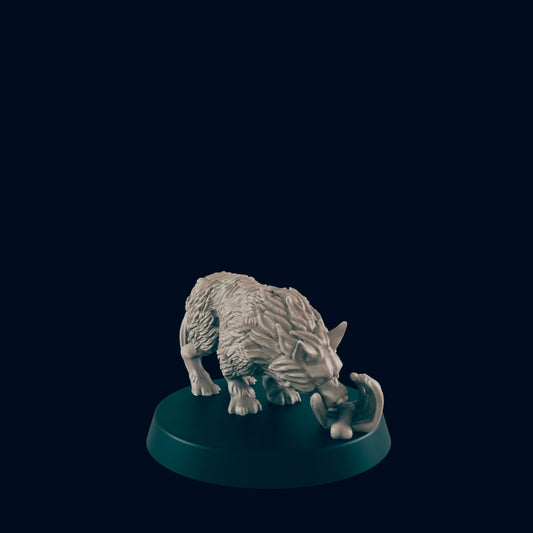 A sculpted wolf, biting a bone, rests on a dark circular base.